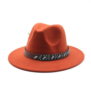 Close-up of the caramel wool felt hat with beaded leather band and turquoise accents