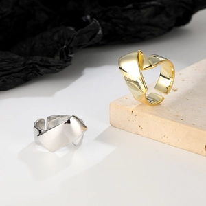 Irregular geometric C-shaped open rings in gold and silver finish for a modern look