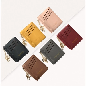 Mini PU leather wallets in various colors featuring three card slots and gold keychains