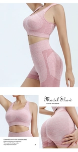 Detail of pink high-waisted fitness shorts with breathable mesh panels and marl texture