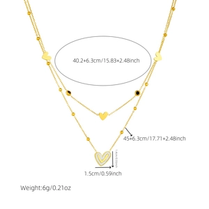 Double-layered gold heart pendant necklace with black beads and white striped charm