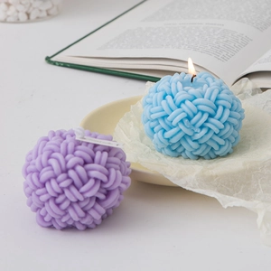 Blue and purple ball of yarn scented candles creating a warm cozy atmosphere for home decor