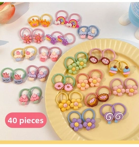 Detail of 40-pack colorful children hair ties with cute resin fruit and cartoon charms