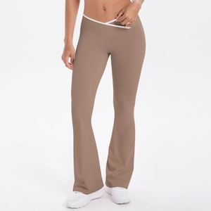 Detail of high-waist flared yoga pants with V-shaped crossover waist and contrast piping