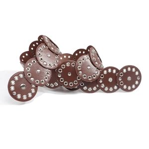 Detail of vintage brown circular leather belt with silver metal rivets and punk stud accents