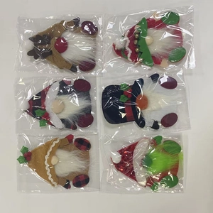 Detailed view of 6-piece Christmas gnome ornaments in protective plastic packaging