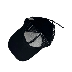 Inside view of a black cotton rhinestone peaked cap with metal buckle and inner support