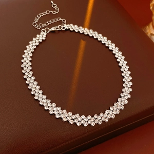 Detail shot of shimmering rhinestone pavé on a silver-plated chain with lobster clasp