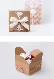 Detailed views of square gift boxes with lace paper, white ribbon bows, and twine ties
