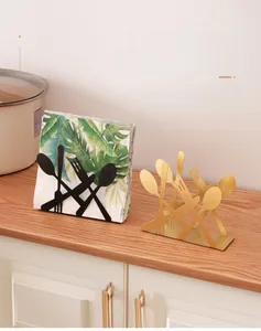 Vertical iron napkin holder with cutlery silhouette design in matte black and gold finish