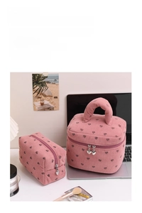 Pink corduroy makeup bag set with black heart patterns and heart zipper charms