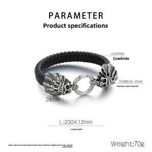 Close-up of woven leather bracelet with stainless steel skull and eagle feather clasp