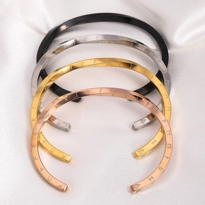 Detailed view of Mobius Viking rune cuffs in black, silver, gold and rose gold metal