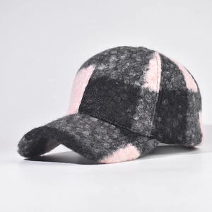 Close-up of color-block sherpa baseball cap with pink, grey and black fleece texture