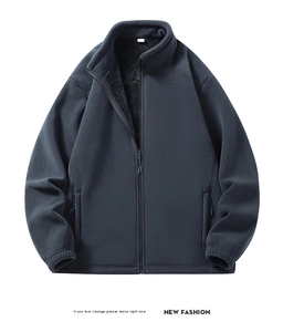 Detailed view of the dark blue fleece jacket with full zipper and windproof stand collar