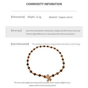 Detail view of gold-plated bead necklace with flower zircon pendant and measurements