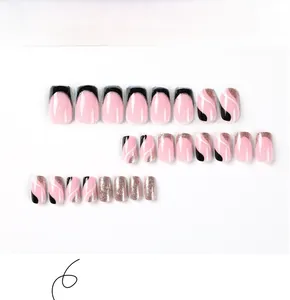 Detailed view of 24pcs glitter ballet press-on nails with black wave and gold lines