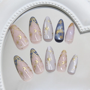 Almond press on nails with moon star patterns and blue marble dreamy texture