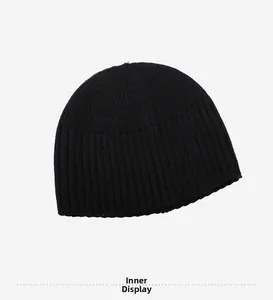 Detailed inside view of the black ribbed knit beanie showing high-quality stitching