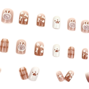 Cute cartoon press-on nails with brown and white cat paw and rabbit patterns