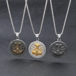 Detailed comparison of three Viking Mjolnir necklaces in gold, black, and silver finishes