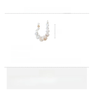Detailed view of 48.5cm shell necklace showing natural white discs and extension chain