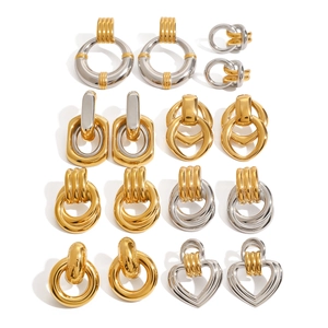 Assorted gold and silver bicolor stainless steel geometric hoop earrings on white background