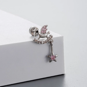 Silver unicorn earrings with pink zircons and star pendant on a white geometric stand