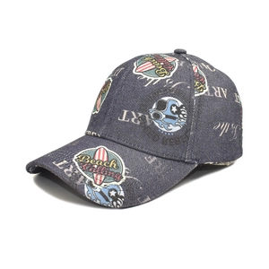 Detail of washed denim baseball cap with beach theme surf print and vintage textures