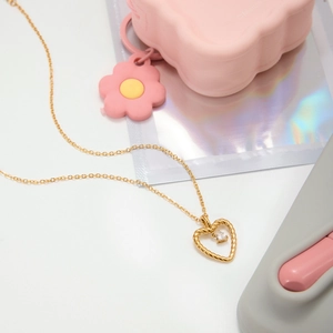 Golden heart necklace with twisted rope edge and crystal pendant on minimalist chain