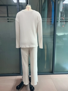 Detail showing beige ribbed knit texture and soft fabric of the two-piece women's lounge set
