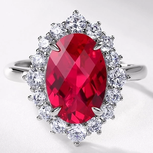S925 silver ring with a large oval red ruby gemstone and sparkling diamond cluster halo