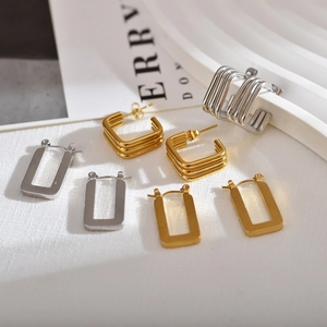 Detailed shot of modern 18K gold and silver plated geometric square hoop earrings