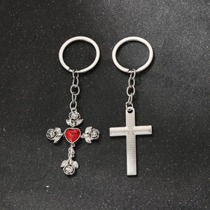 Detailed view of Gothic rose cross keychain with red heart gemstone and engraved prayer