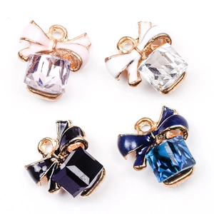 Bowknot crystal jewelry charms in pink, white, black, and blue with gold finish