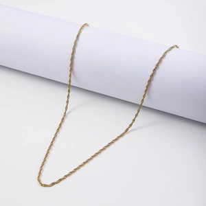 Detailed macro view of an 18K gold plated stainless steel Singapore twist chain necklace