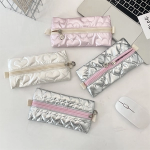 Quilted heart pattern PU pencil cases in silver and pink with flower-shaped zippers