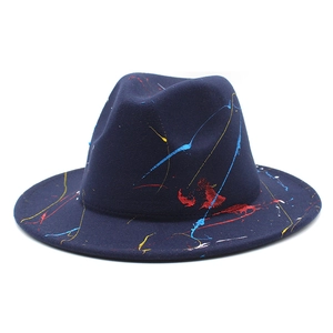 Detailed side view of navy wool fedora hat featuring artistic colorful paint splatter