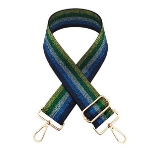 Detail of multi-color striped fabric strap with gold metal buckles and lobster clasps