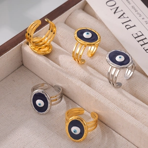 Evil eye stainless steel open rings in gold and silver finish on velvet display