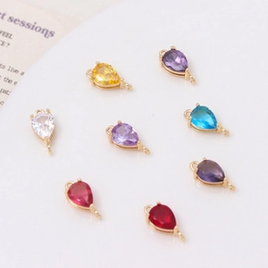 Macro view of colorful teardrop zircon charms with dual loops for DIY jewelry making