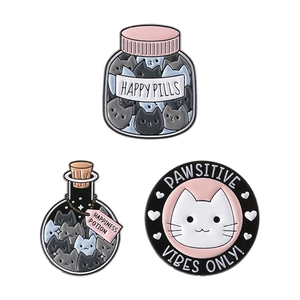 Three-piece set of cartoon cat enamel pins featuring Happy Pills and Pawsitive Vibes themes