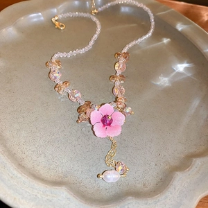 Star pendant necklace with champagne crystal beads, pink flower, and baroque pearl tassel