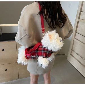 Detailed shot of a plush Westie dog crossbody bag with a red plaid jacket and shoulder strap