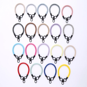 Short wrist lanyard straps for phone cases in various woven and faux leather colors