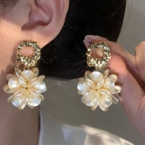 French vintage gold-plated floral earrings with white resin petals on a gold circle hoop