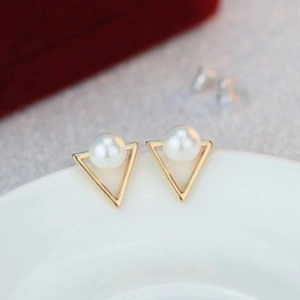 Elegant geometric gold triangle stud earrings with round white pearl in a minimalist style