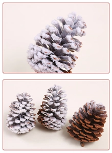Detail of flocked pine cones showing realistic snow texture and natural brown scales