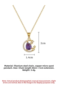 Detail view of gold moon pendant with purple teardrop gem and sizing measurements