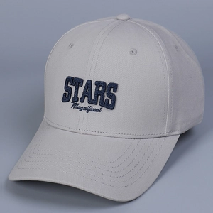 Close-up of blue STARS Magnificent 3D embroidery on light grey cotton baseball cap